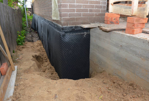 Happy homeowners after waterproofing job in Guntersville